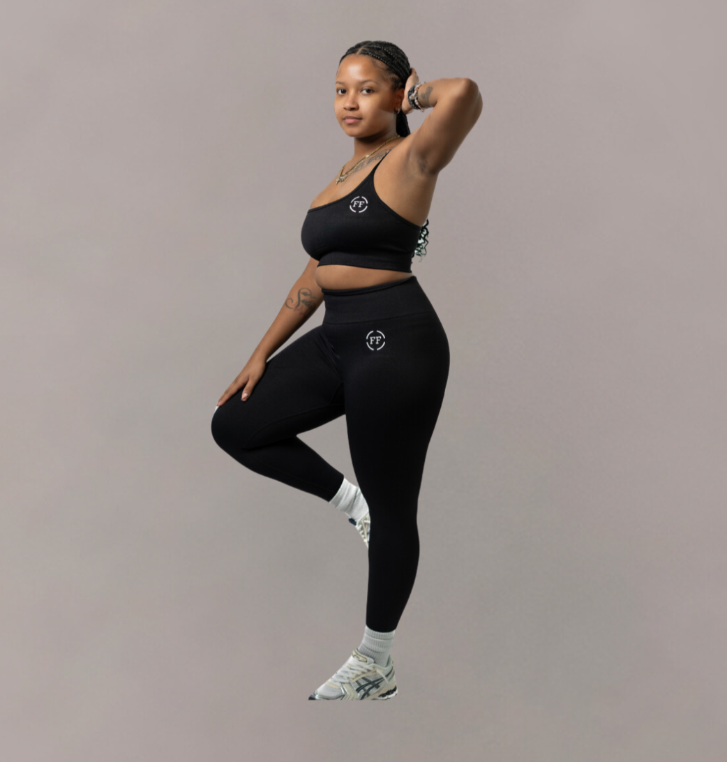 Woman wearing Fitnesse black top and matching leggings. Athleisure wear 