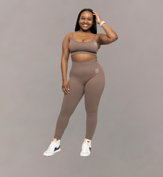 Woman wearing Fitnesse brown top and matching leggings. Athleisure wear 