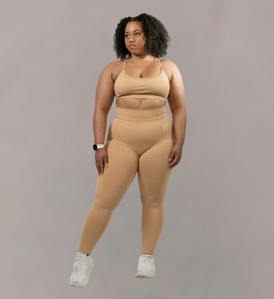 Woman wearing Fitnesse tan top and matching leggings. Athleisure wear 
